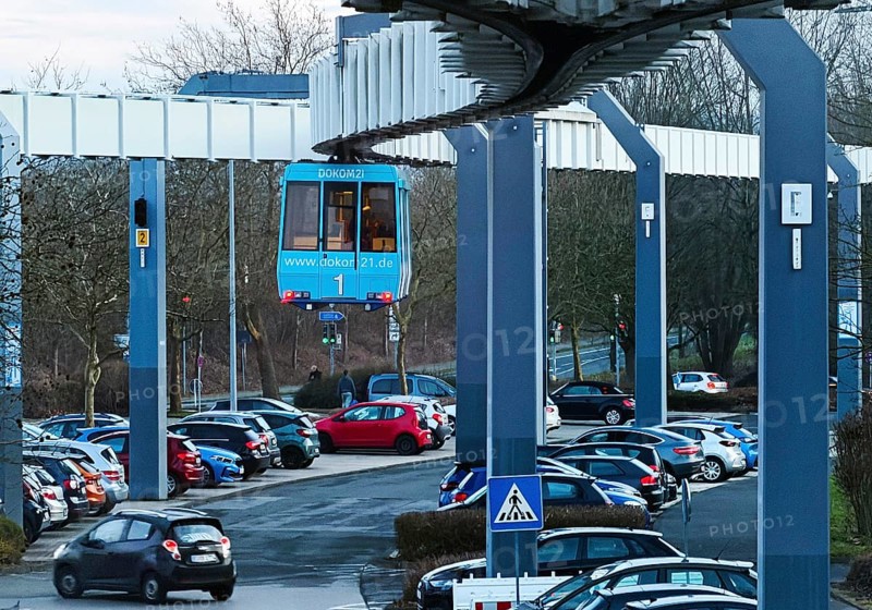 The H Bahn, an automatically controlled large cabin suspension railway above the parking lot of the university campus, Dortmund, Germany
