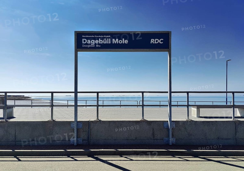 Dagebüll Mole sign of the Norddeutsche Eisenbahn Niebüll with a view of the North Sea, Schleswig-Holstein, Germany