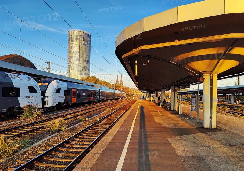 On the train track with a view of the Cologne Triangle skyscraper at sunrise, Deutzer Bahnhof, Cologne, Rhineland, North Rhine-Westphalia, Germany
