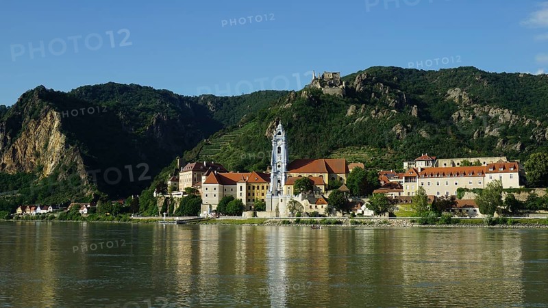 City view of Dürnstein across the Danube, with river and mountainous surroundings, Danube cycle path, Wachau World Heritage Region, Austria
