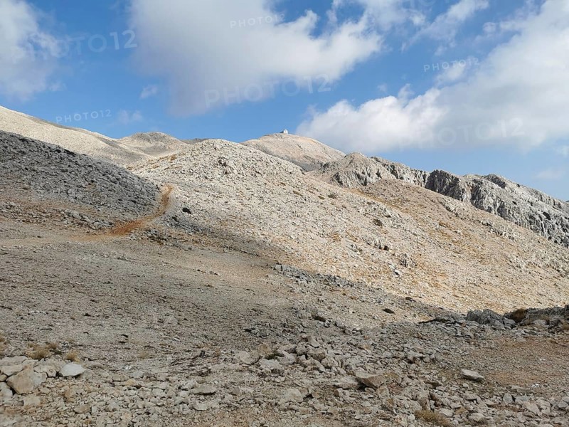 Rocky mountain landscape on Tahtali Dagi, peaks in sight, under a partly cloudy sky, climbing Tahtali Dagi, Lycia, Turkey
