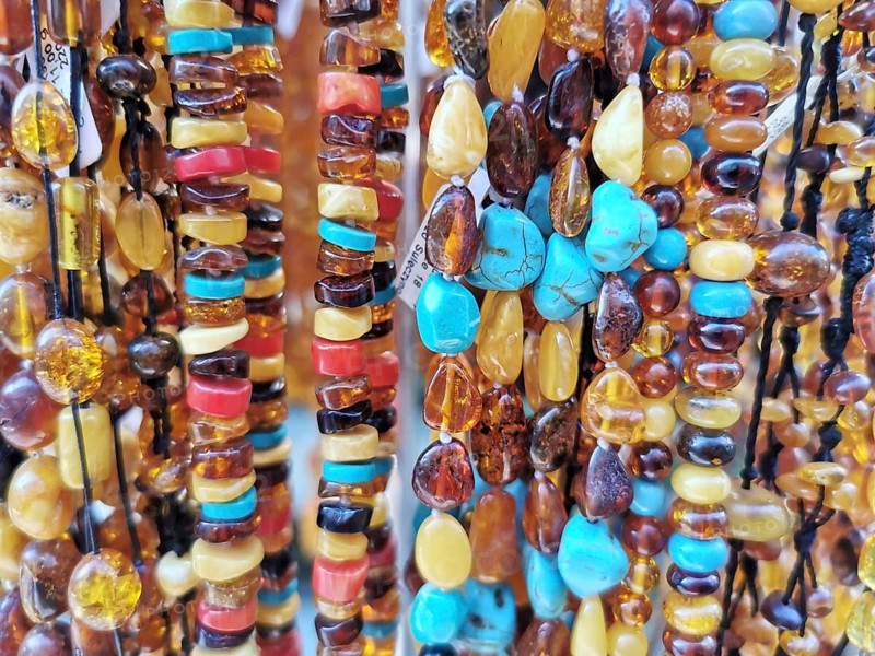 Close-up of amber and colorful gemstones and pearls in various colors, Baltic Sea, Danzig, Poland