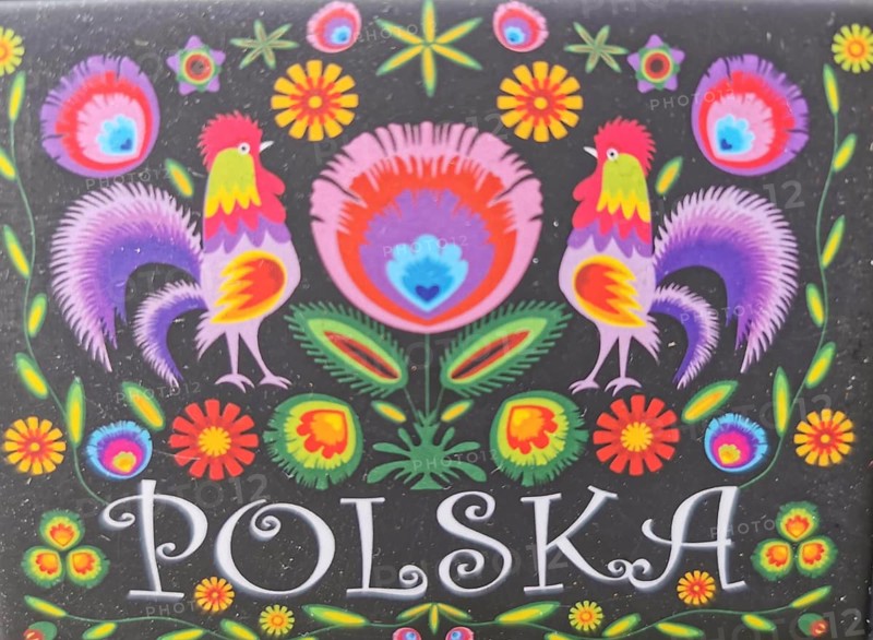 Colourful traditional Polish folk art with roosters and flowers on a black background and the inscription Polska, Poland