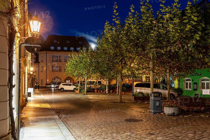 Atmospheric night view at a small market with a full moon, Meissen, Saxony, Germany