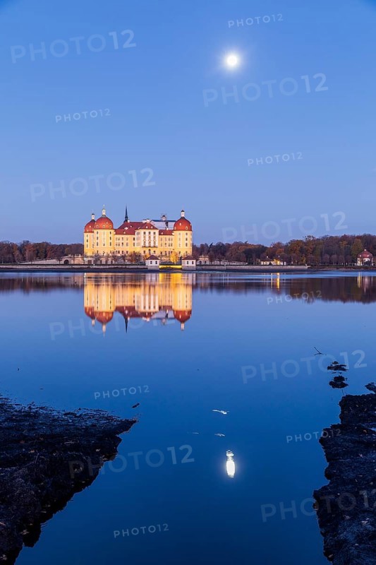 Moritzburg hunting lodge with full moon early in the morning, Meissen district, Saxony, Germany