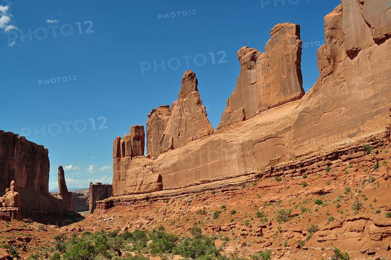 Majestic sandstone rocks, Wall Street, dominate the landscape under a clear sky, Arches National Park, Utah, USA