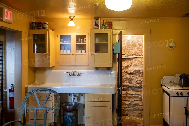 Grand Canyon National Park, Arizona - The kitchen in the historic Kolb Studio on the Canyon's South Rim. In 1903, Ellsworth and Emery Kolb established their photography studio and home here and photographed mule riders descending the Bright Angel Trail. The Canyon's rocks can be seen through the open door