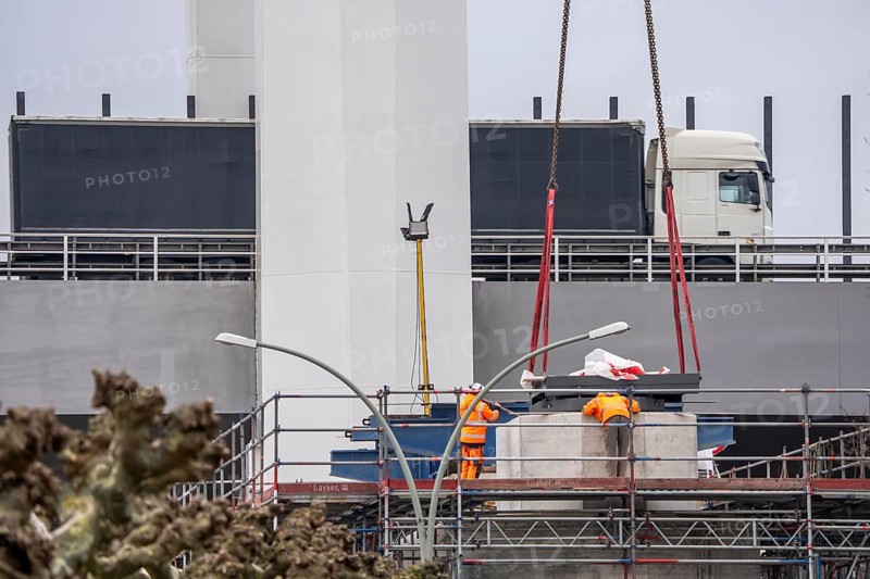 Duisburg-Neuenkamp Rhine bridge, the A40 motorway, construction of the second bridge begins, bridge pillars are being built on the Du-Homberg side of the Rhine, truck on the completed first section of bridge, North Rhine-Westphalia, Germany