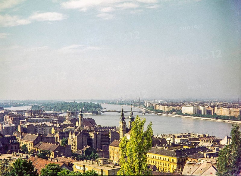 Cityscape over rooftops to River Danube, Budapest, Hungary, Europe 1967 view to Margaret Island and bridge