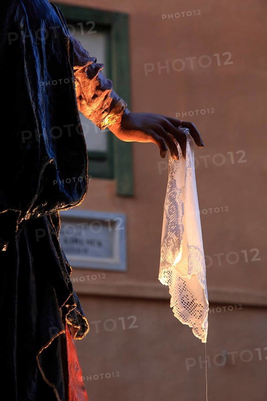 Sicily, old town of Trapani, Good Friday mystery procession La Processione dei Misteri, hand holding white handkerchief