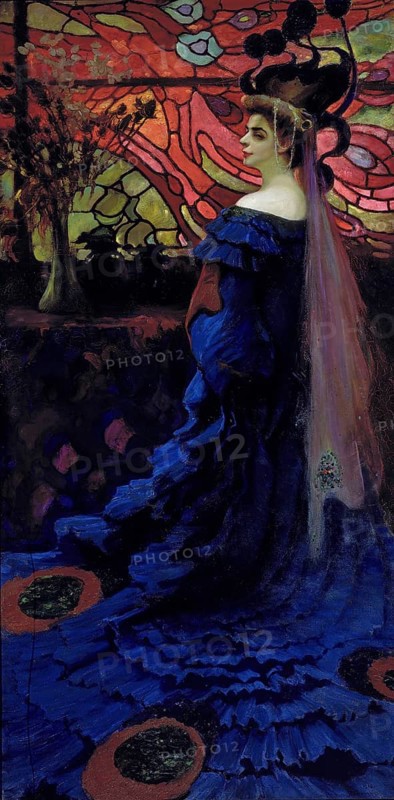 Kazimierz Stabrowski (b. 21 November 1869, d. 10 June 1929 in Garwolin), Polish painter: Peacock, portrait of Zofia Borucinska née Jakimowicz (1908), Woman in front of a stained glass window. The Peacock, portrait of Zofia Borucinska, authentic, digitally restored reproduction from an early 20th century original, exact date of depiction unknown, Historical, A woman in a magnificent blue dress stands in front of an ornate, colourful background