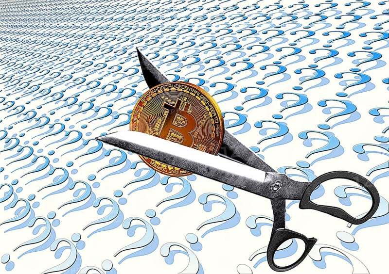 Symbolic image, scissors divide Bitcoin into question marks, stock prices, uncertain digital currency, resources, energy, industry, critical economy, stock market hype, stock market crash, payment, insolvency, wrong decisions, maximum profit, profit slump, stock prices, location Germany, global economy, globalization, environmental protection, mafia, Trump corrupt enrichment, Bitcoin rally, cryptocurrency, electronic wallet wallet, crypto reserve, stock exchange Handel