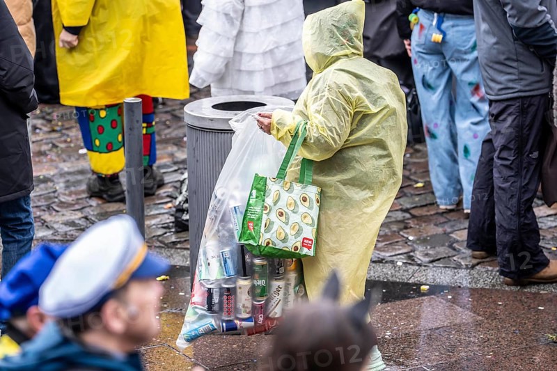 Pawn collector in the old town moving on Rose Monday in Düsseldorf, North Rhine-Westphalia, Germany