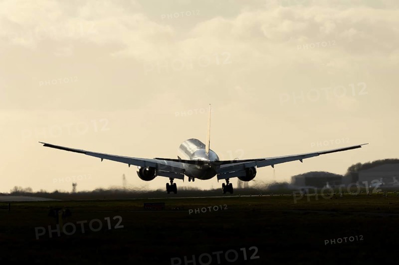 Boeing 777 A7-BFL commercial jet aircraft of Qatar cargo in flight on approach to land at London Stansted airport, Essex, England, United Kingdom