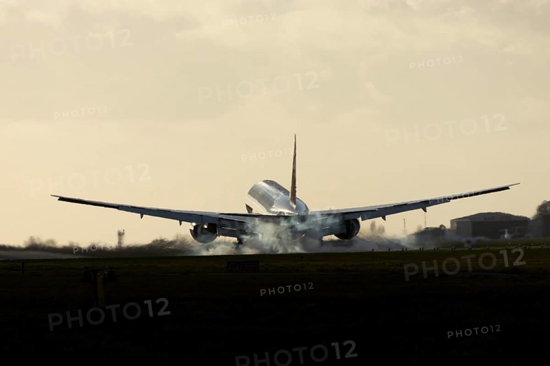 Boeing 777 A7-BFL commercial jet aircraft of Qatar cargo in flight landing on the runway at London Stansted airport, Essex, England, United Kingdom