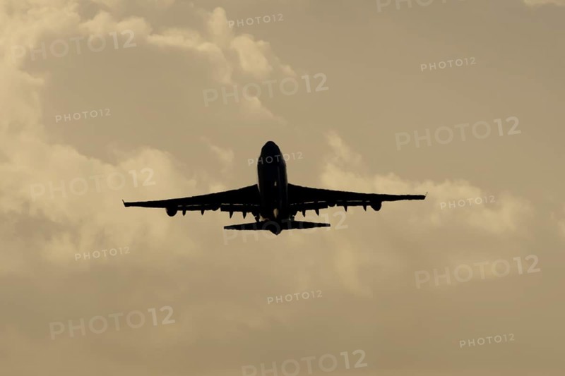 Boeing 747-400 jumbo jet LX-TCV commercial aircraft of Cargolux cargo taking off in flight silhouette at sunset at London Stansted airport, Essex, England, United Kingdom