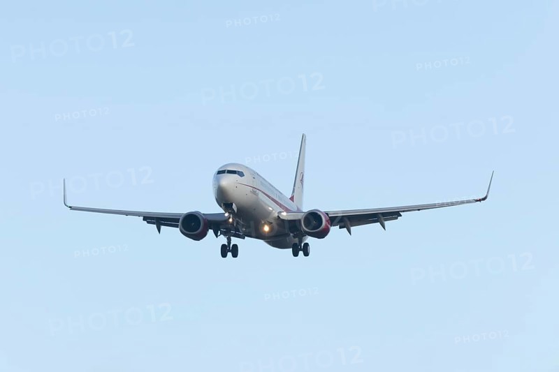 Boeing 737 commercial passenger airliner jet aircraft in flight on approach to land at London Stansted airport, Essex, England, United Kingdom