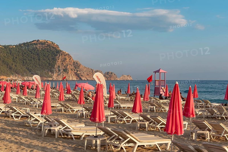Alanya, Turkey. July 9th 2024 Sunbeds and pink sunshades on Cleopatra Beach in the Turkish holiday resort town of Alanya on the Mediterranean coast of Turkey, the Turkish Riviera