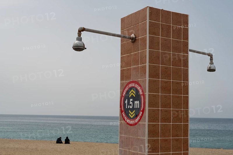 Alanya, Turkey. April 6th 2021 Social distancing instructions on a public shower on Kleopatra beach, Alanya, Turkey