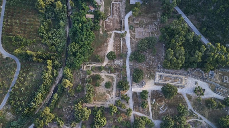 Olympic excavation site from high altitude, Temple of Zeus, Temple of Hera, Leonidaion, Palestra Philippeion, etc. Historic ruin road embedded in a wooded landscape, taken from the air, drone shot, archaeological site, Ancient Olympia, Olympia, Peloponnese, Greece