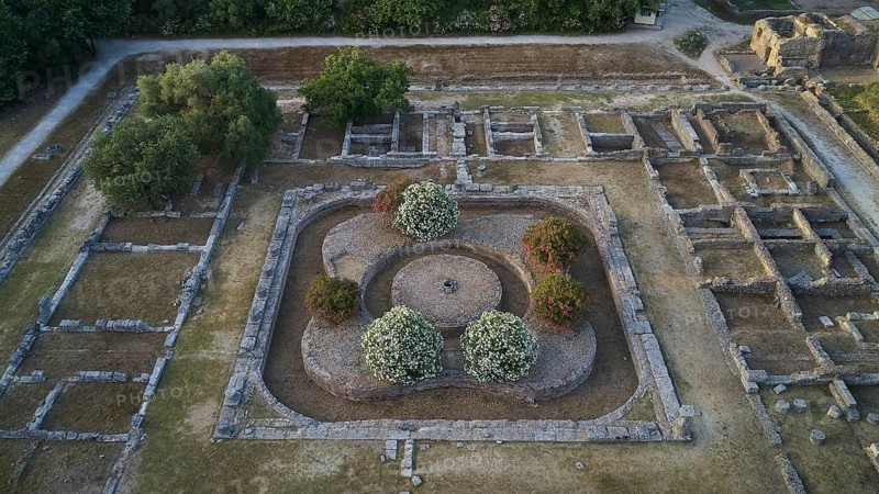 Soft morning light, central part of Leonidaion, aerial view of ancient foundations surrounded by trees and vegetation, drone view, archaeological site, Ancient Olympia, Peloponnese, Greece