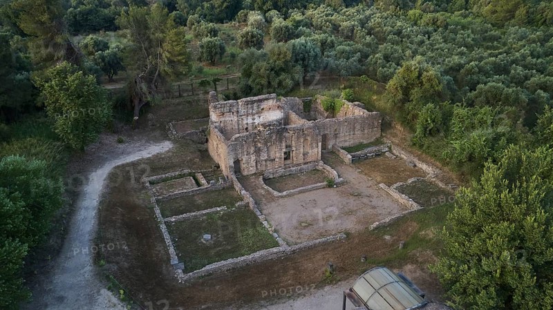 Building below Leonidaion, stone ruins of an ancient building surrounded by trees and paths, drone shot, archaeological site, Ancient Olympia, Olympia, Peloponnese, Greece