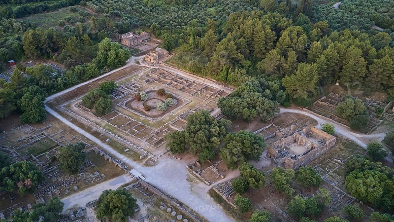 Soft morning light, Leonidaion, workshop of Phidias and early Christian Bailica, Heroon, Theocoleon, aerial view of ancient ruins surrounded by thick forest and trails, drone shot, archaeological site, Ancient Olympia, Olympia, Peloponnese, Greece