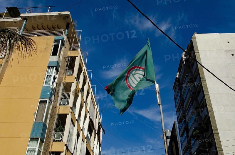 Beirut, Lebanon. May 29th 2012 The flag of the Shia dominated Amal Movement fluttering in a downtown Beirut neighborhood, Lebanon