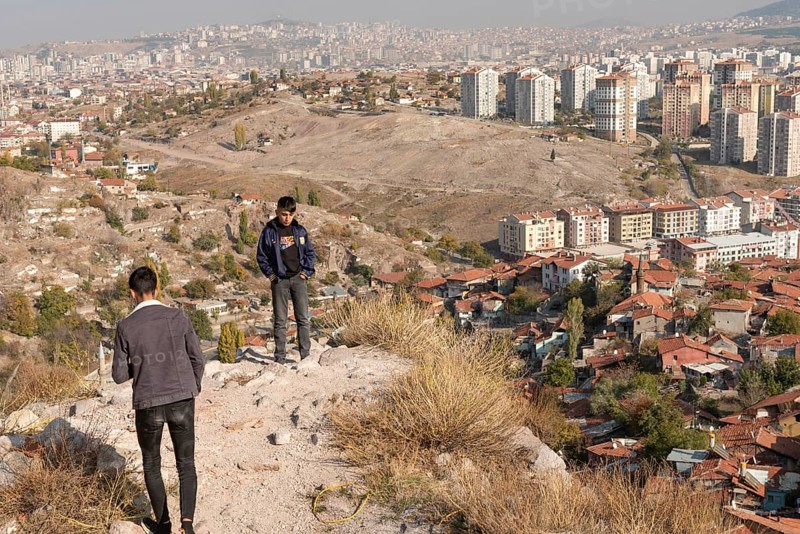 Ankara, Turkey. November 17th 2020 Young Turkish teens at Ankara castle with the urban sprawl of the capital city of Turkey