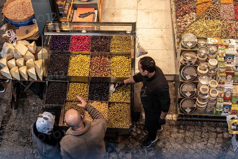 Istanbul, Turkey 7th January 2025 . Shoppers buying olives in a popular Turkish market near the famous Egyptian or Spice Bazaar in Istanbul, Turkey