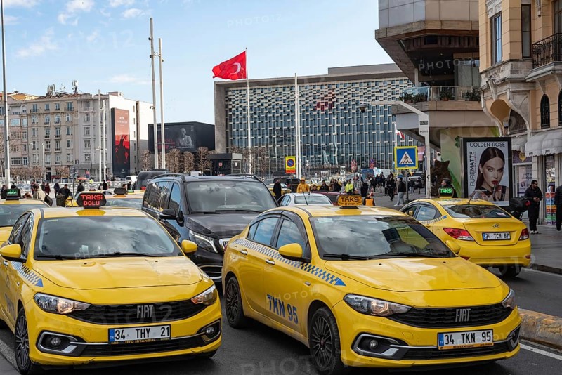 Istanbul, Turkey. January 3rd 2025. Yellow Turkish taxi cabs in busy traffic around Taksim square, Istiklal street, central Istanbul, Turkey