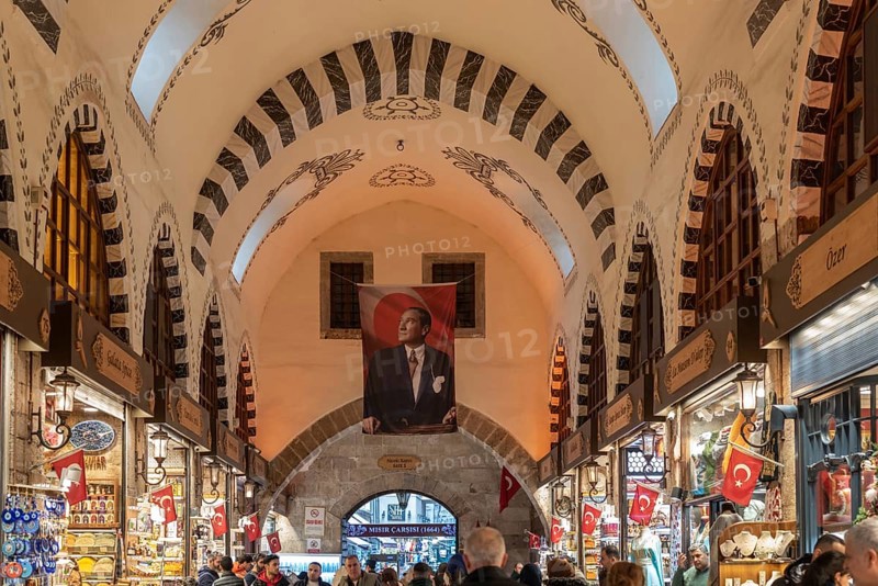 Portrait of Mustafa Kemal Ataturk displayed inside the vaulted architecture of the Istanbul Spice Bazaar