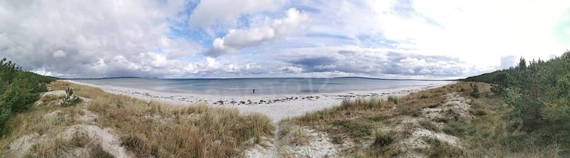 Panoramic view of secluded beach under cloudy sky, Rügen, Baltic Sea