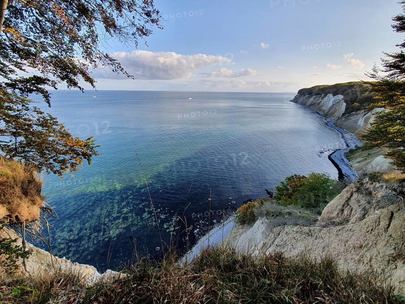 Extensive view of the cliffs with chalk cliffs and the sea under clear skies, Jasmund National Park, Rügen, Baltic Sea