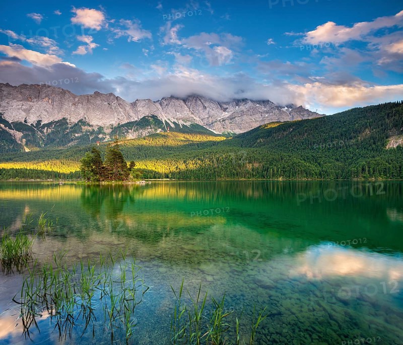 Evening on Lake Eibsee lake, the Wetterstein Mountains with the Zugspitze in the background, clouds sweeping across the peaks, Grainau, Garmisch-Partenkirchen, Bavaria, Germany