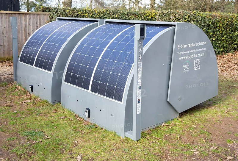 Two EEZYPODS secure, solar-powered e-bike charging and storage units operated by the UK-based company EEZYBIKE, UK