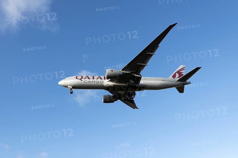 Boeing 777 A7-BFL commercial jet aircraft of Qatar cargo in flight on approach to land at London Stansted airport, Essex, England, United Kingdom