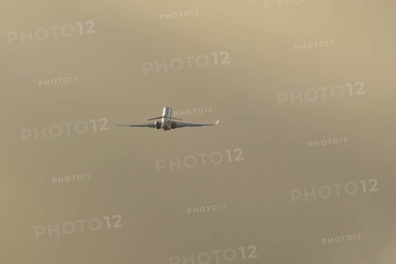Gulfstream executive business jet aircraft in flight at sunset at London Stansted airport, Essex, England, United Kingdom