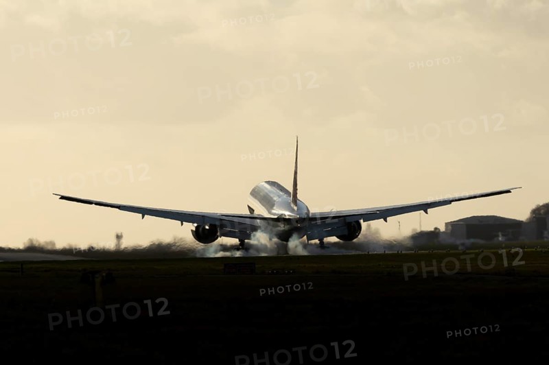 Boeing 777 A7-BFL commercial jet aircraft of Qatar cargo in flight landing on the runway at London Stansted airport, Essex, England, United Kingdom