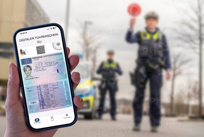 Symbolic image, photo montage, the digital driving license, on a smartphone app, should be available at the end of 2026 and stored in the i-car app of the Federal Motor Transport Authority, EU driving license, here at a police check