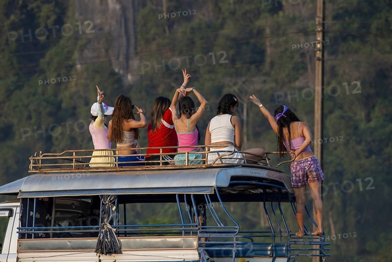 Photo shoot with young girls in the karst landscape near Vang Vieng, Vientiane province, Laos