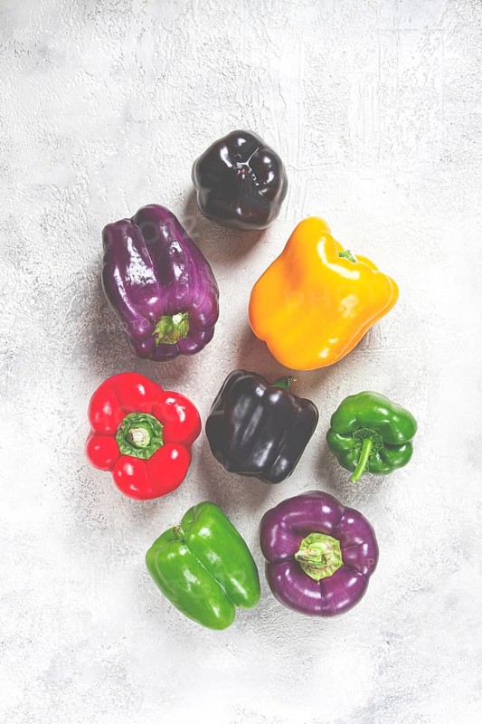 Assortment, of colorful bell peppers, on a light background, top view, no people