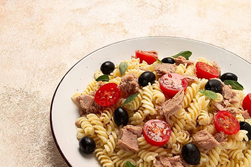 Tuna salad, fusilli pasta, olives and cherry, olive oil, homemade