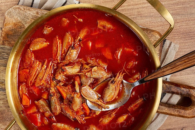 French shrimp bisque soup, in a pot, close-up, no people