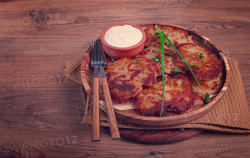 Potato pancakes, pancakes with sour cream, Belarusian dish, homemade, no people