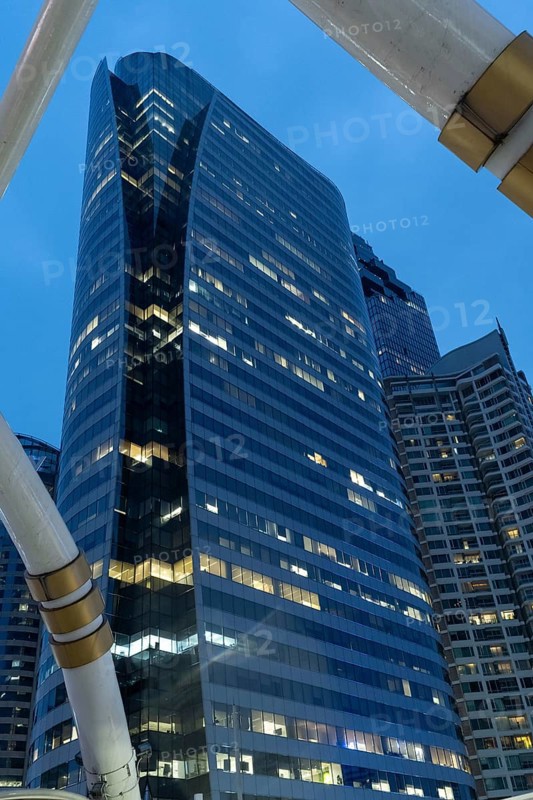 Bangkok, Thailand. March 26th 2025. Modern high rise office and condo buildings at night in Sathon Square part of the Bangkok business district, Thailand, Asia