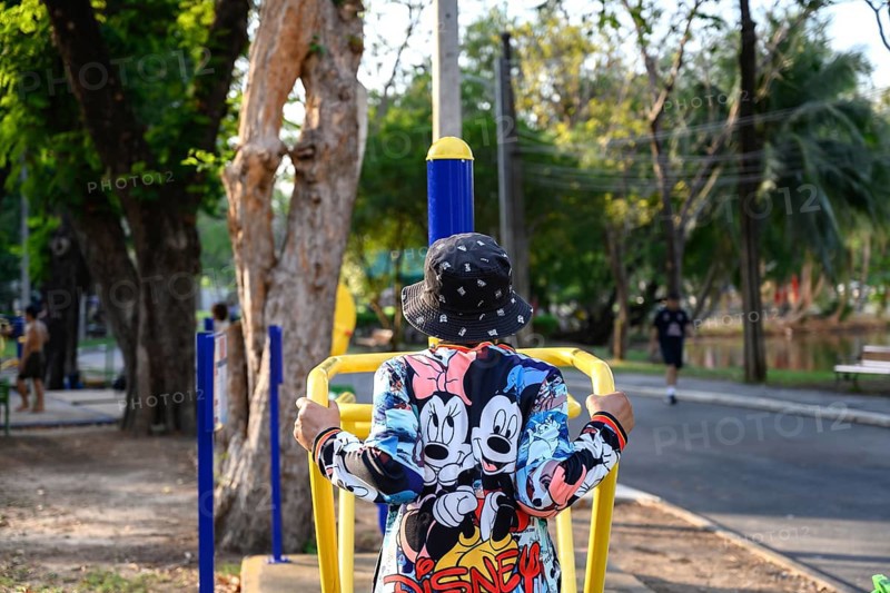 Bangkok, Thailand. March 4th 2025. An elderly lady uses the public outdoor gym exercise machines in Lumphini Park, Bangkok