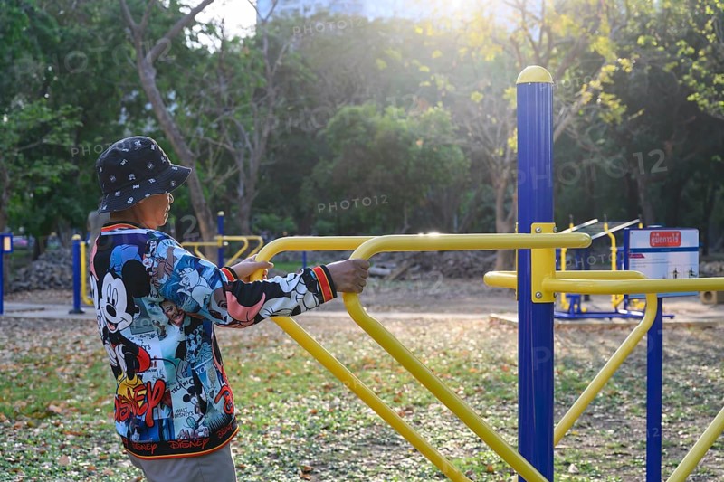 Bangkok, Thailand. March 4th 2025. An elderly lady uses the public outdoor gym exercise machines in Lumphini Park, Bangkok, Thailand