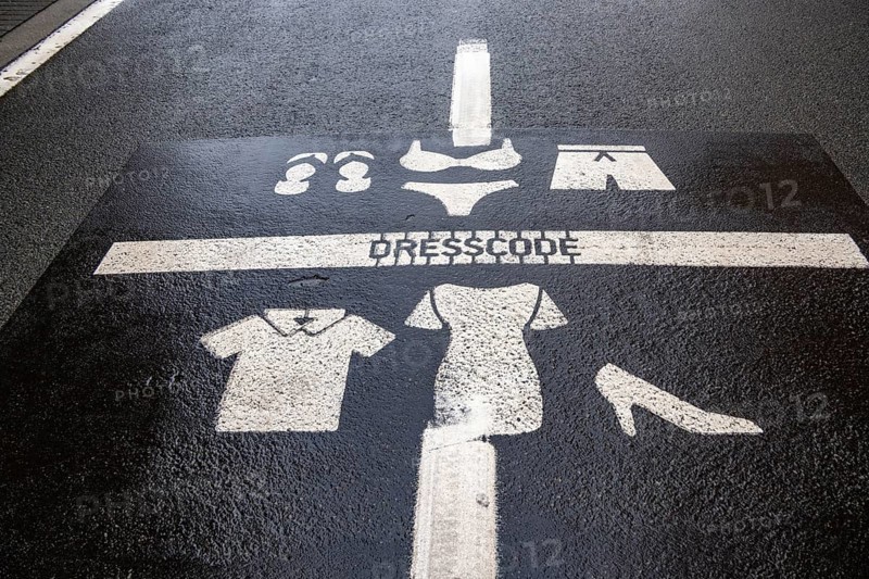 Winter break, on the Zeedijk-Knokke, beach promenade in Knokke-Heist, commandment sign, prohibition sign, for the dress code on the North Sea beach and in the city, painted on the road surface, dreary winter day, Belgium
