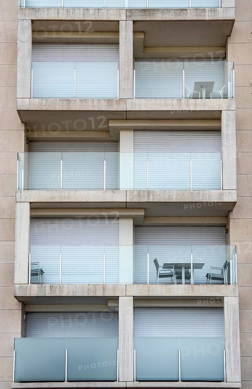Facades of residential buildings on Zeedijk-Knokke, beach promenade in Knokke-Heist, largely uninhabited in winter, on the North Sea beach, dreary winter day, mostly apartment buildings with rental or condominiums, high-rise buildings on the street, Belgium